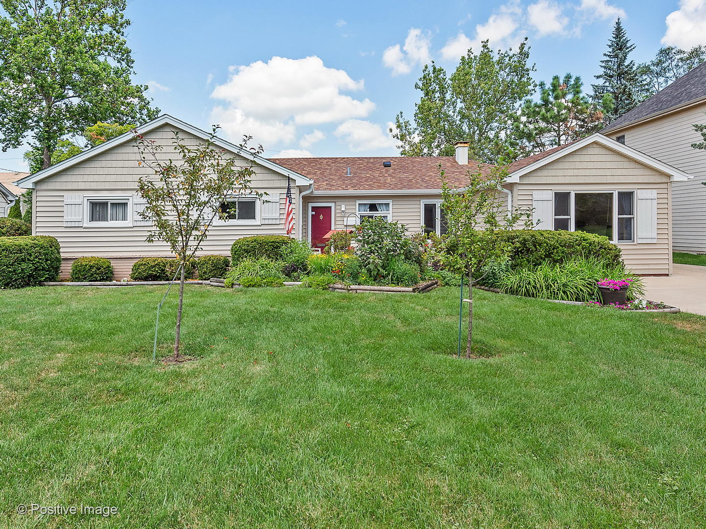 521 Ranch Road Wheaton, IL 60187 - Photo 1 of 22 a front view of a house with a yard and green space