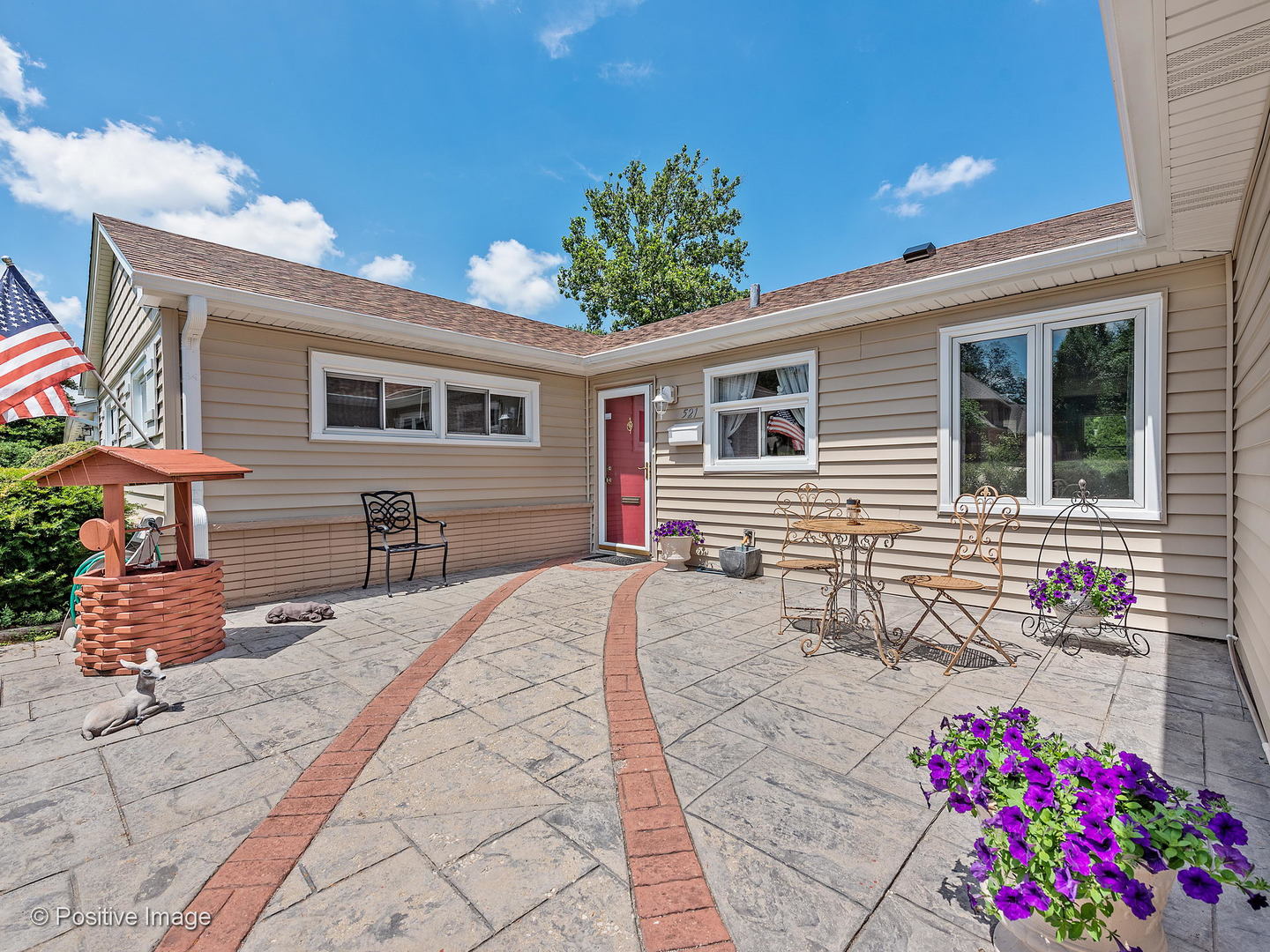 521 Ranch Road Wheaton, IL 60187 - Photo 2 of 22 a front view of a house with a yard