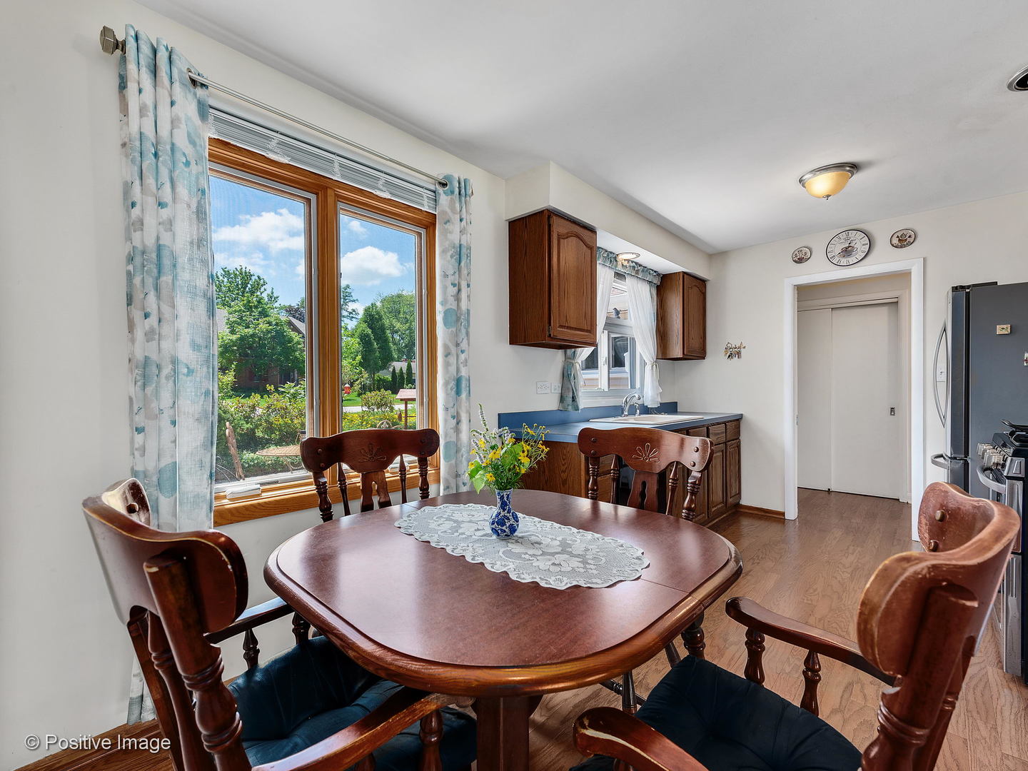 521 Ranch Road Wheaton, IL 60187 - Photo 11 of 22 a view of a dining room with furniture window and outside view