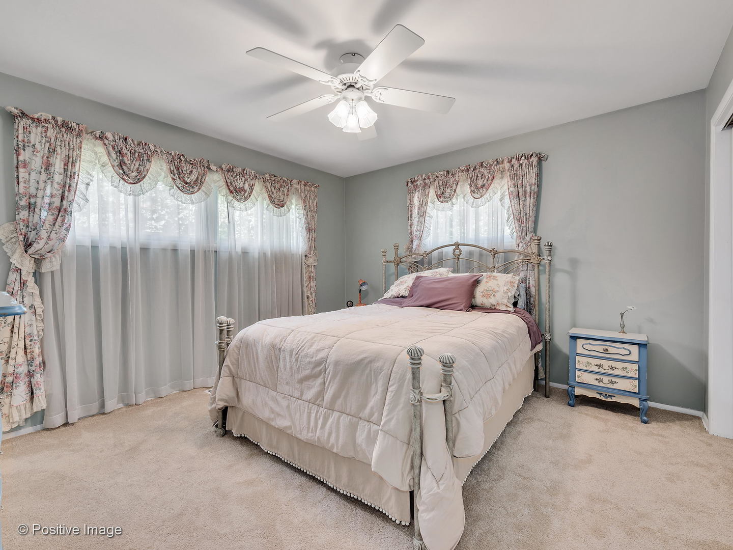 521 Ranch Road Wheaton, IL 60187 - Photo 12 of 22 a bedroom with a bed and a chandelier