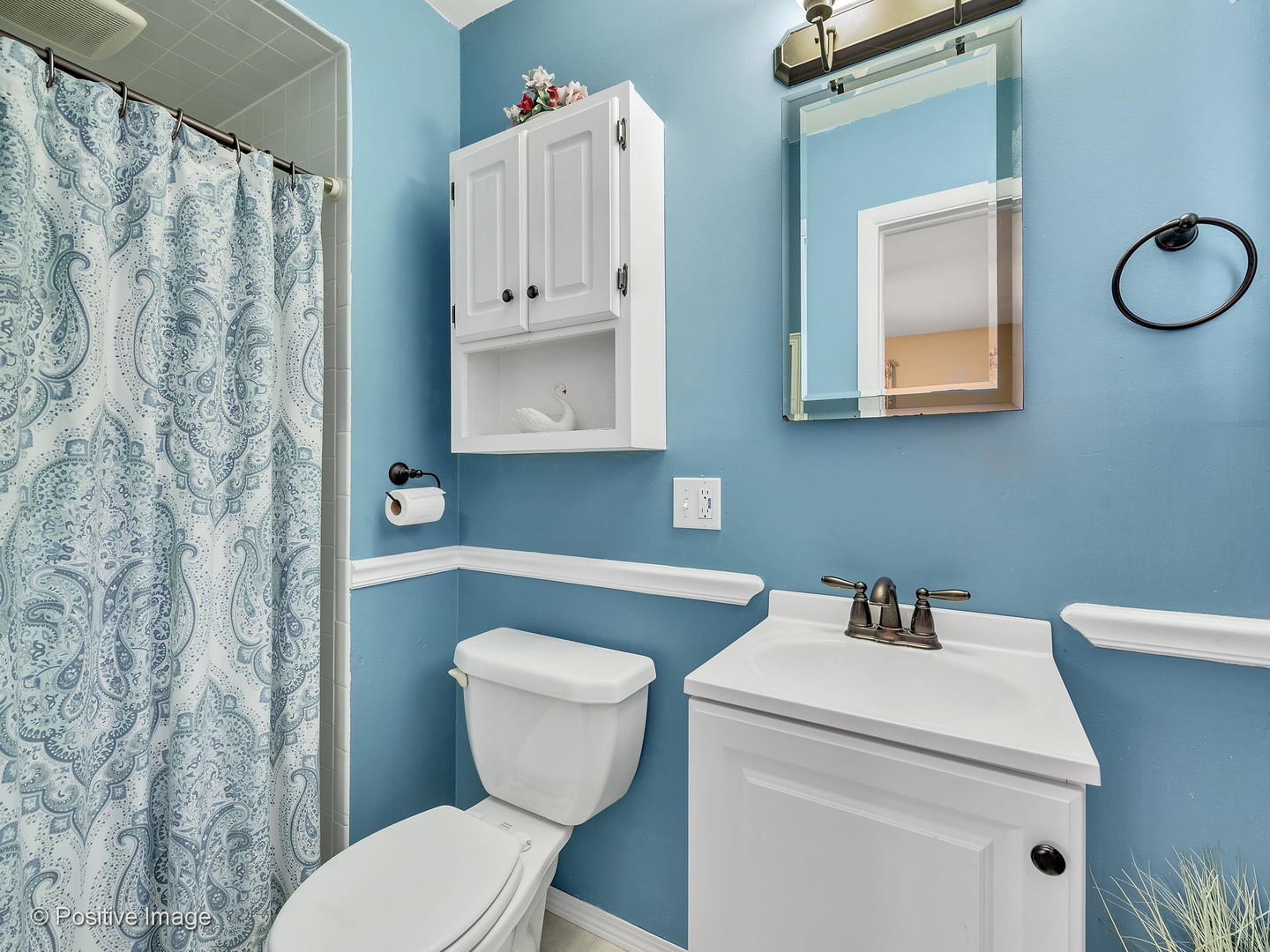 521 Ranch Road Wheaton, IL 60187 - Photo 13 of 22 a bathroom with a toilet sink and mirror