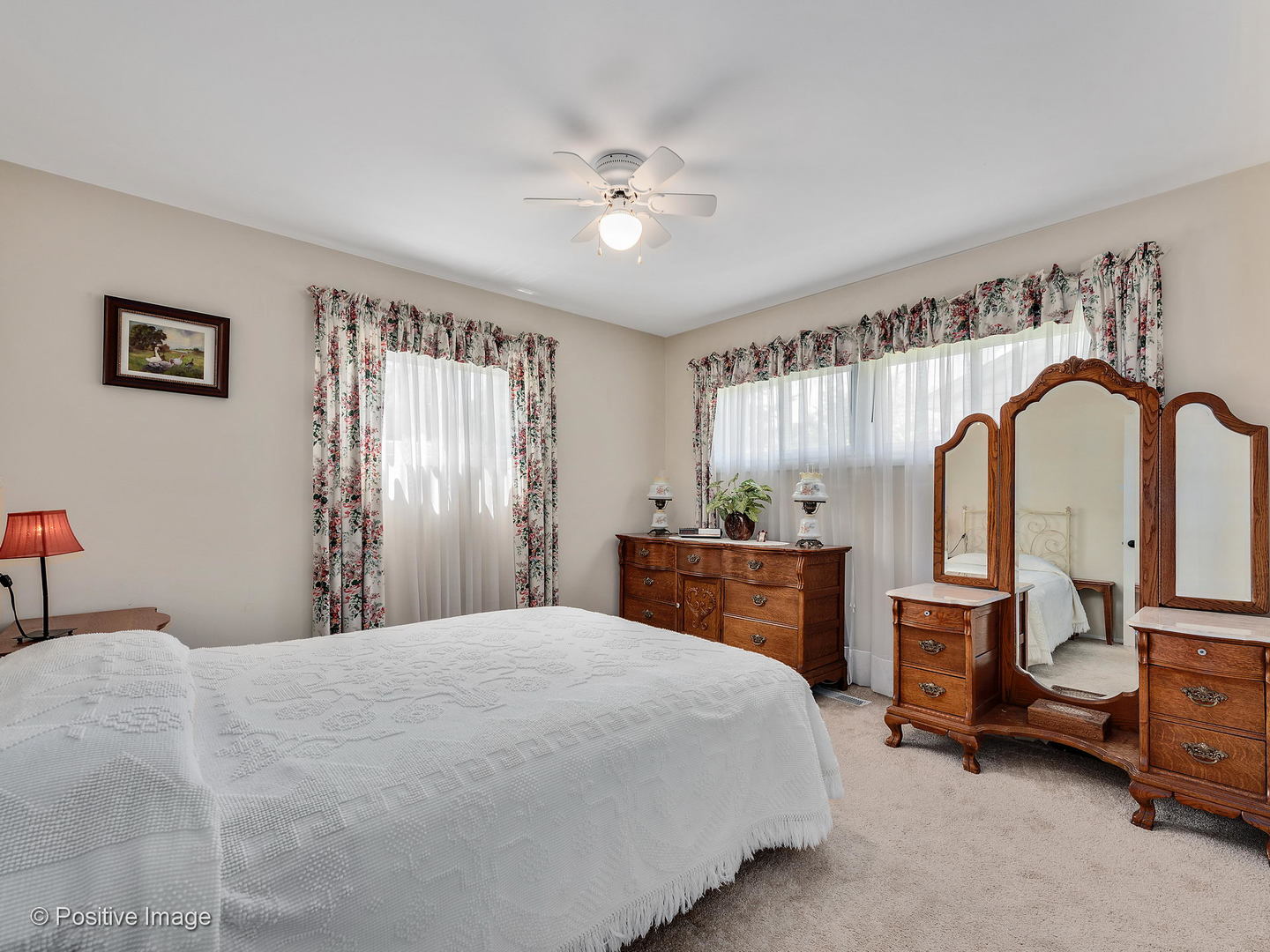 521 Ranch Road Wheaton, IL 60187 - Photo 14 of 22 a bedroom with a large bed and a chandelier