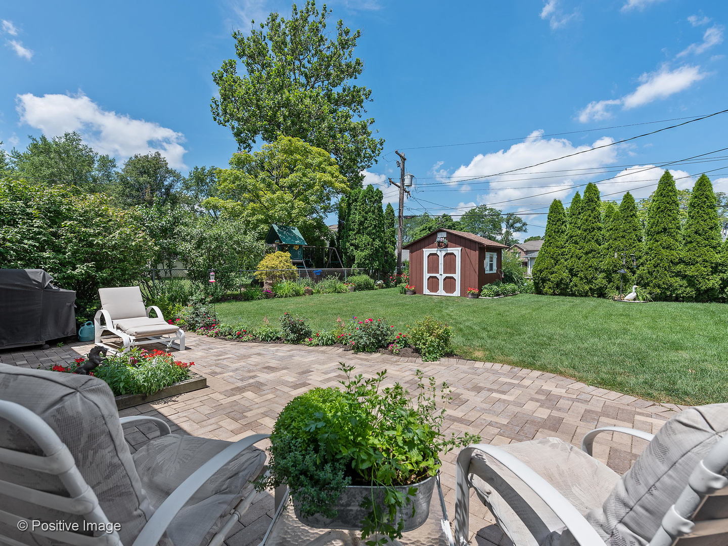 521 Ranch Road Wheaton, IL 60187 - Photo 18 of 22 a view of a backyard with sitting area