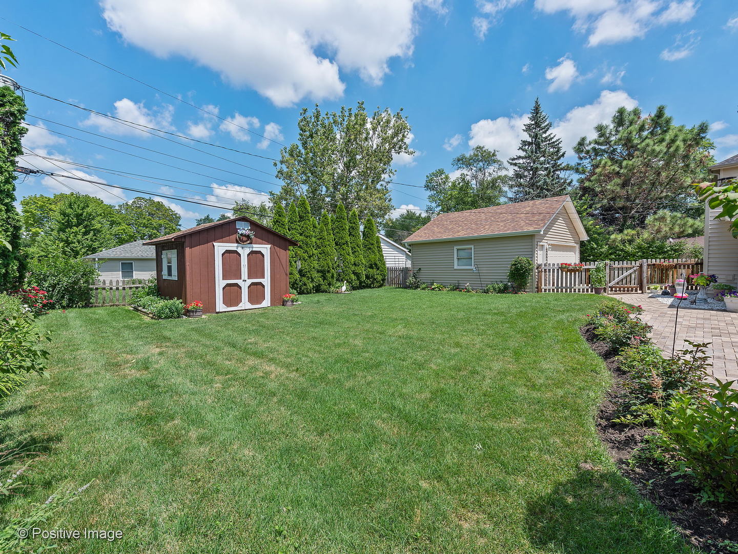521 Ranch Road Wheaton, IL 60187 - Photo 20 of 22 a front view of a house with garden