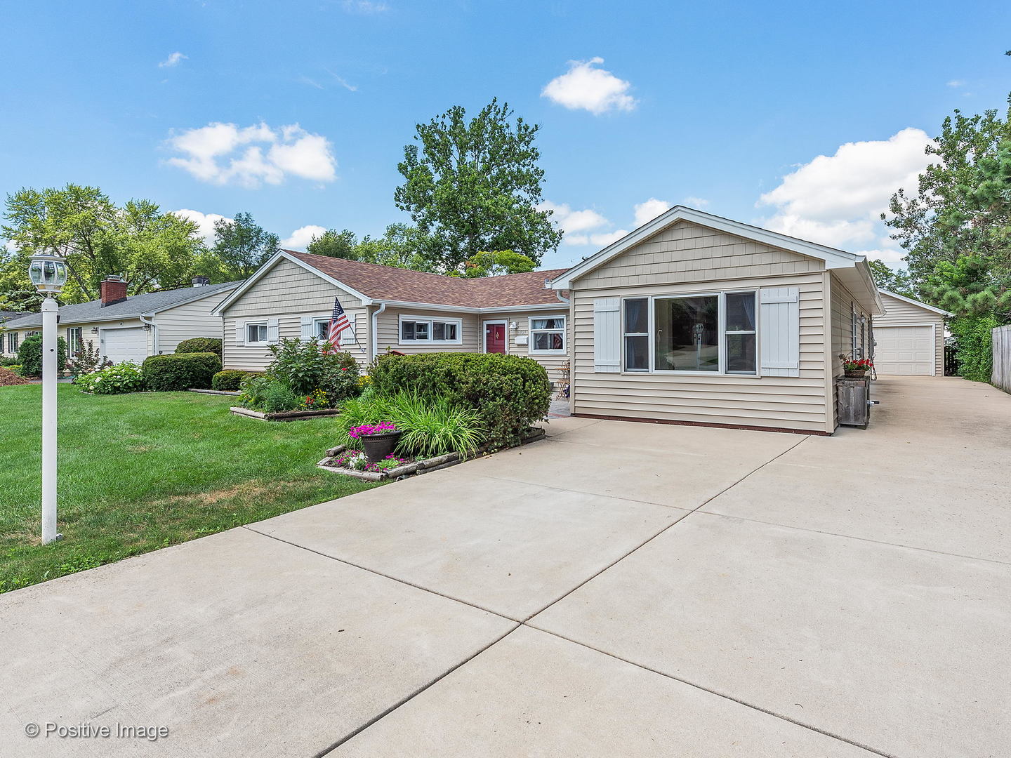 521 Ranch Road Wheaton, IL 60187 - Photo 3 of 22 a front view of a house with a yard