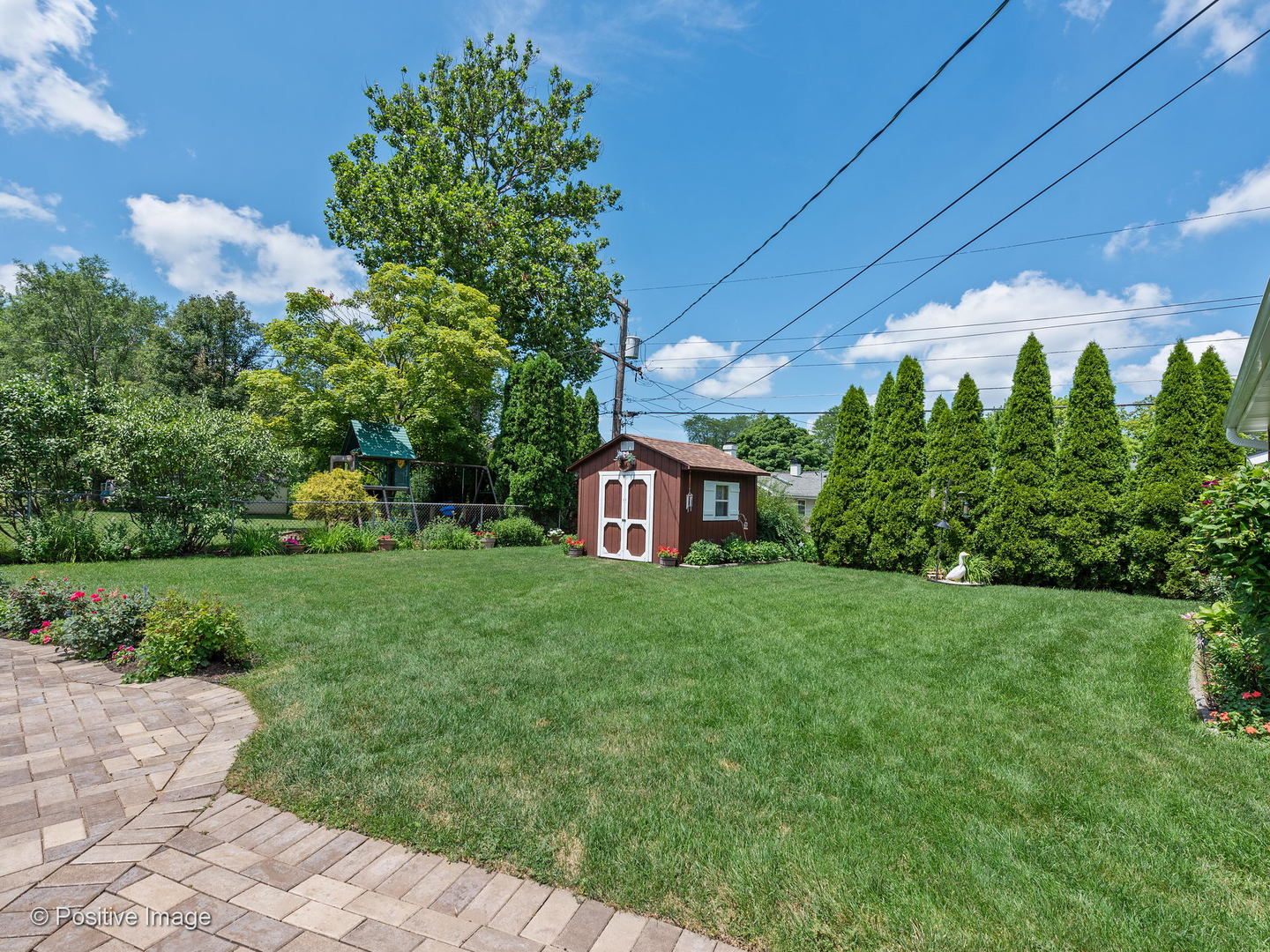 521 Ranch Road Wheaton, IL 60187 - Photo 21 of 22 a view of a house with a yard and garden