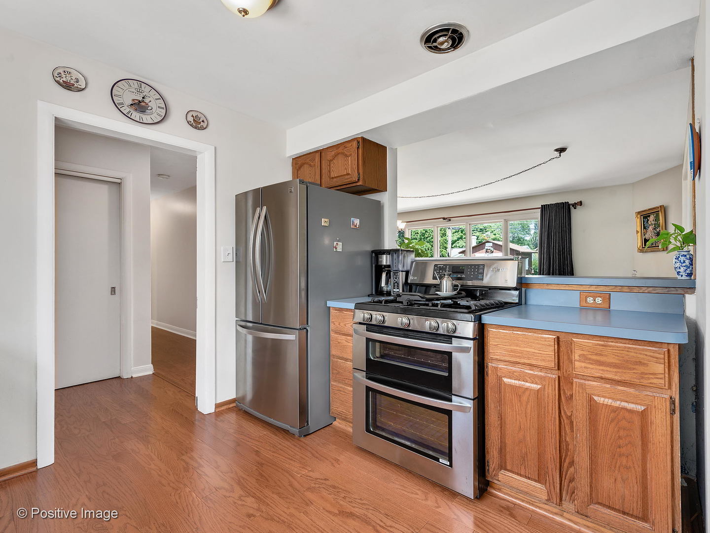 521 Ranch Road Wheaton, IL 60187 - Photo 10 of 22 a kitchen with stainless steel appliances granite countertop a refrigerator and a stove
