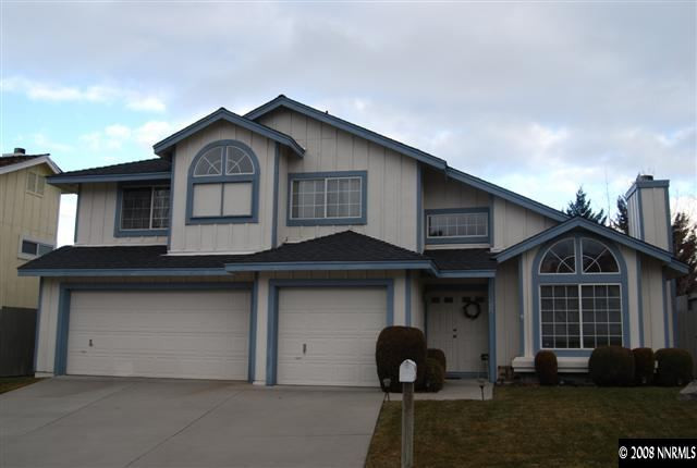6212 Alpine Meadows Road Reno, NV 89519 - Photo 1 of 9 a front view of a house with garage