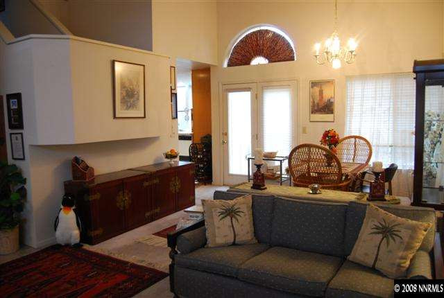 6212 Alpine Meadows Road Reno, NV 89519 - Photo 3 of 9 a living room with furniture a large window and potted plants