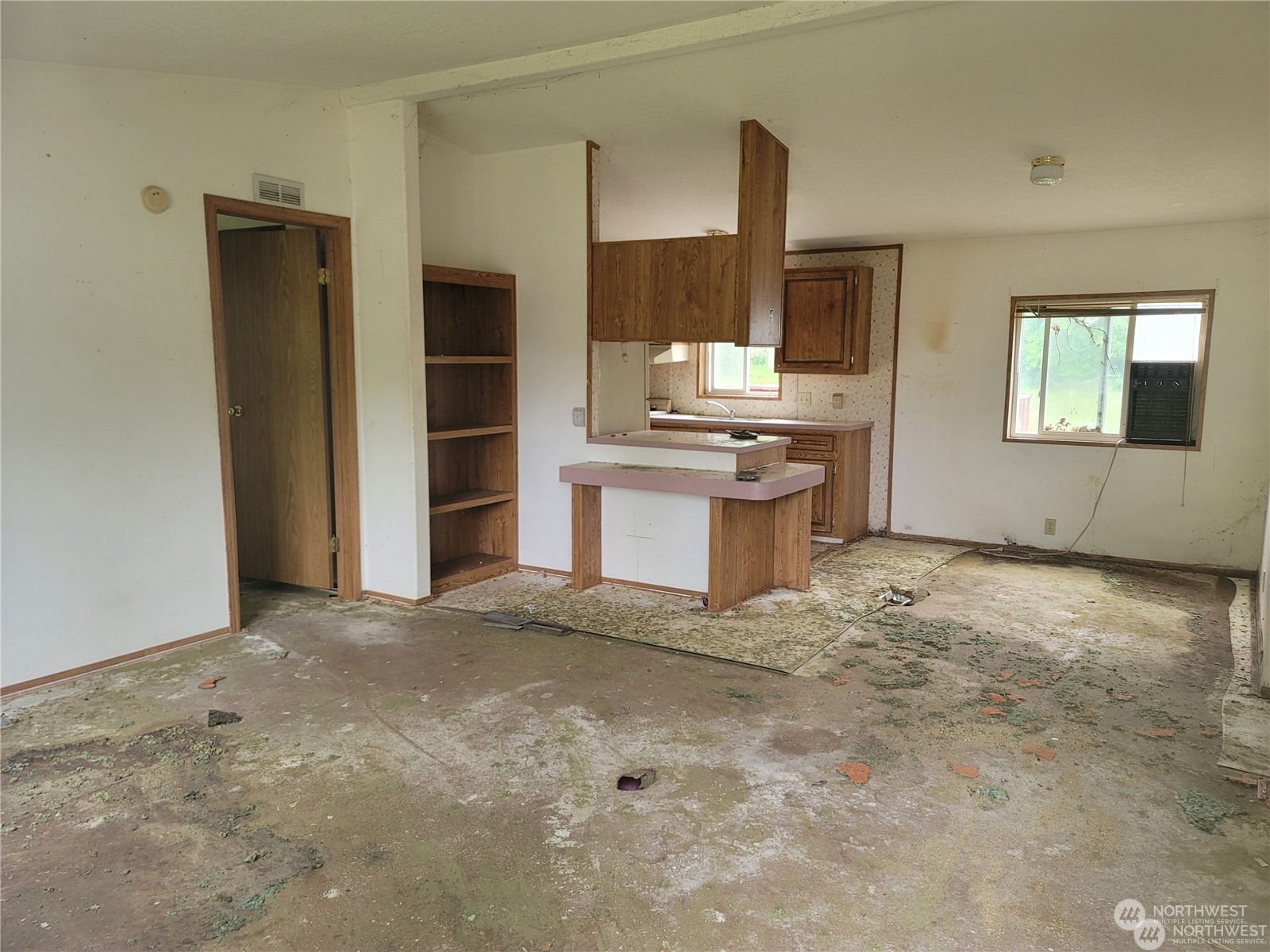 120 Wennassee Loop Silver Creek, WA 98585 - Photo 12 of 23 a view of a kitchen with a sink a refrigerator and window