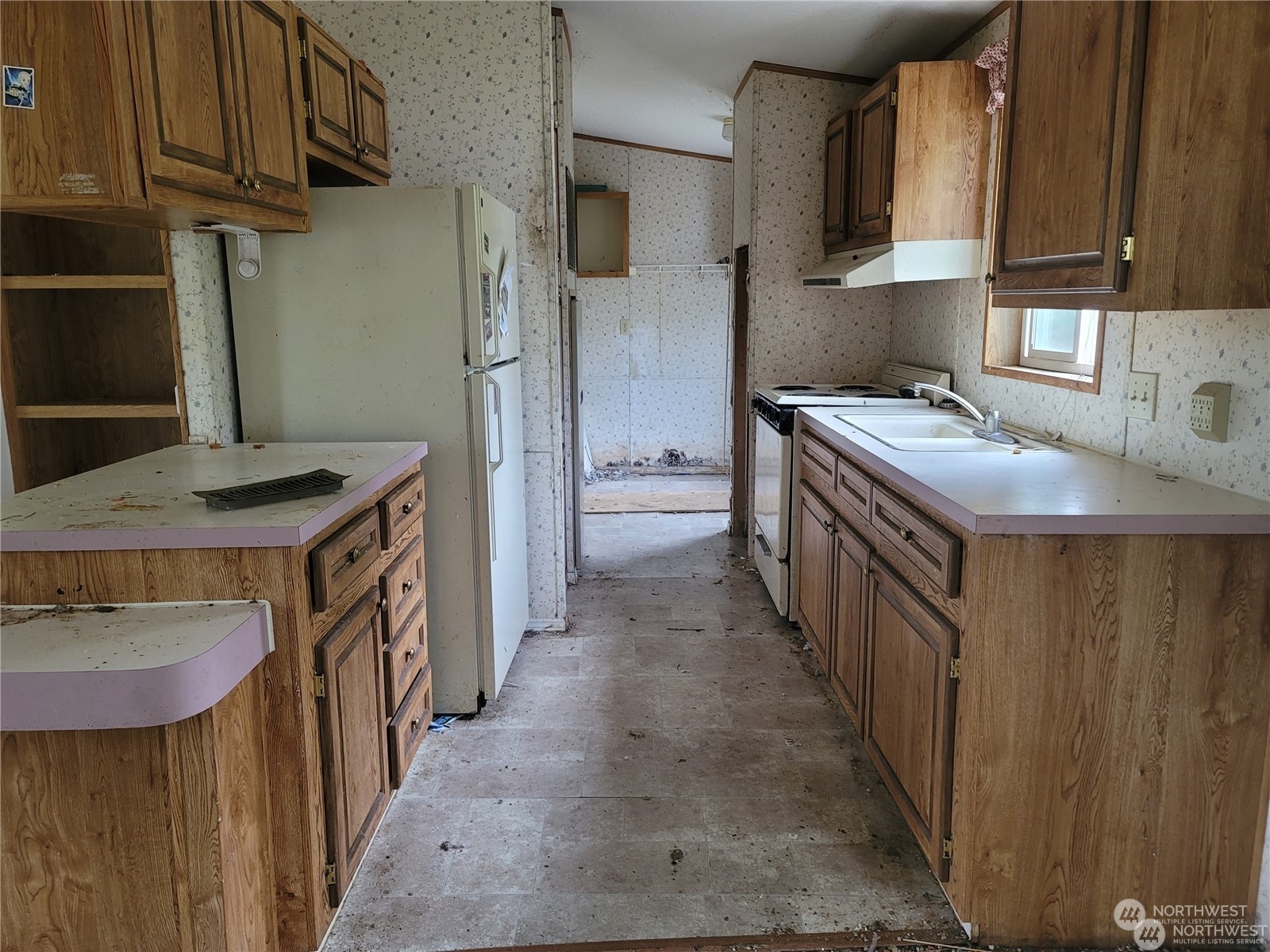 120 Wennassee Loop Silver Creek, WA 98585 - Photo 16 of 23 a kitchen with stainless steel appliances granite countertop a sink stove and refrigerator