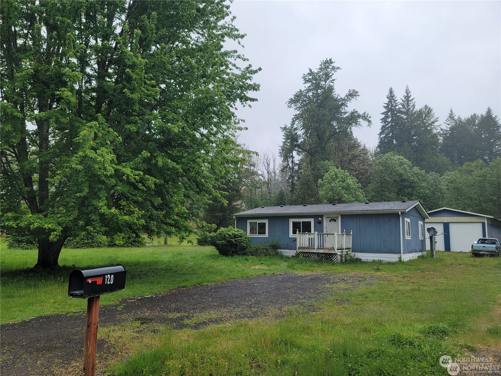 120 Wennassee Loop Silver Creek, WA 98585 - Photo 2 of 23 a front view of house with yard and trees
