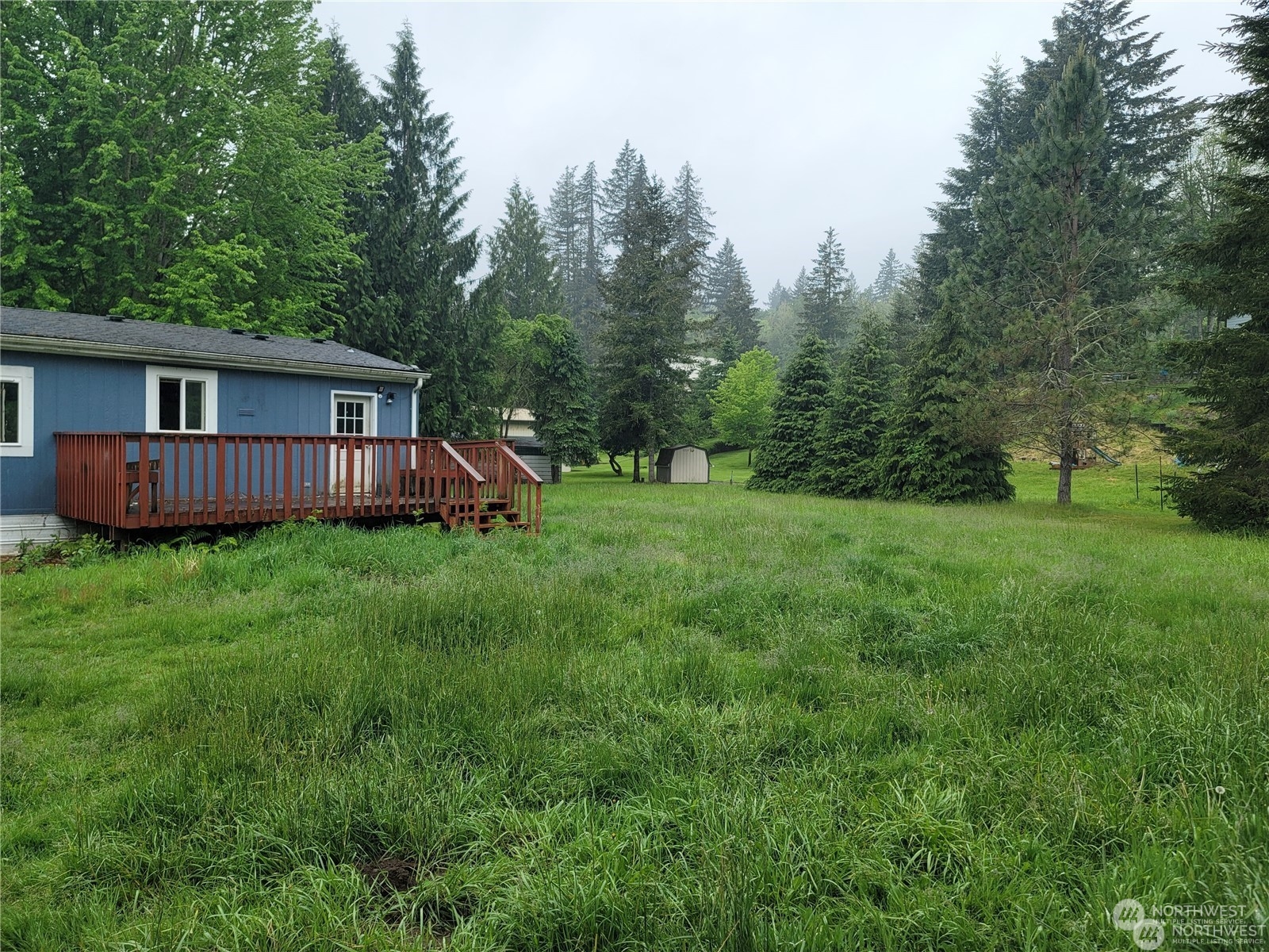 120 Wennassee Loop Silver Creek, WA 98585 - Photo 21 of 23 a view of a house with backyard and trees