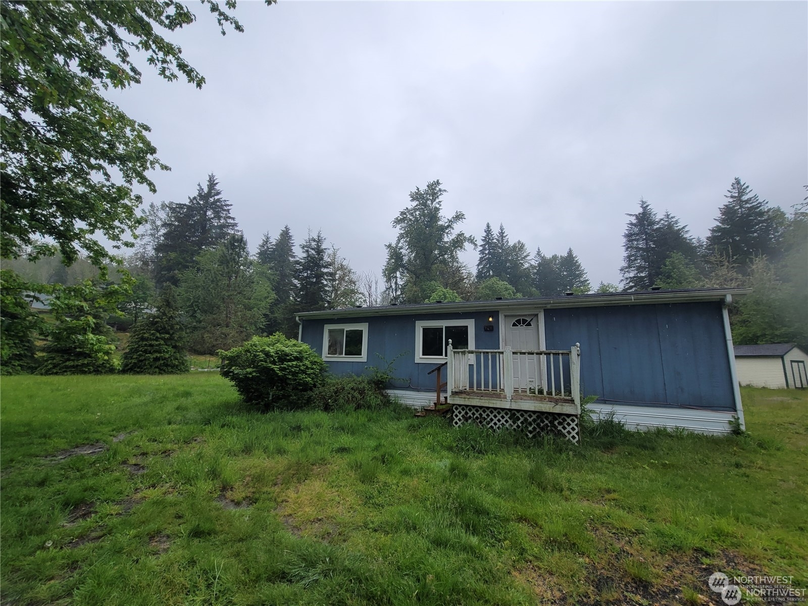120 Wennassee Loop Silver Creek, WA 98585 - Photo 4 of 23 a backyard of a house with lots of green space
