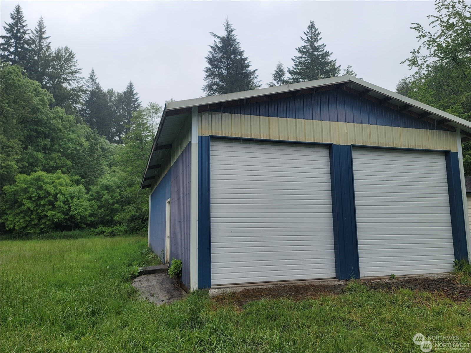 120 Wennassee Loop Silver Creek, WA 98585 - Photo 6 of 23 a house with green field in front of it