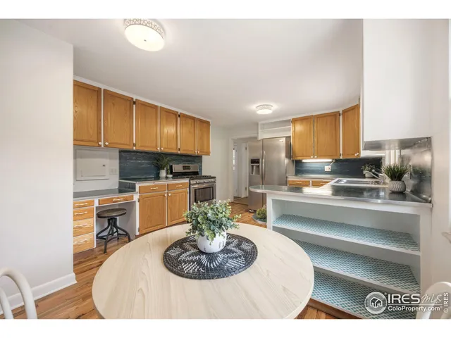 a kitchen with a sink stove and refrigerator