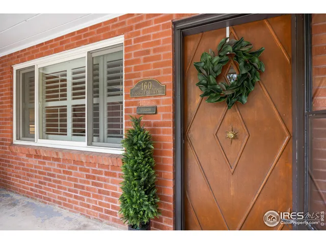 a view of a window with a flower pot