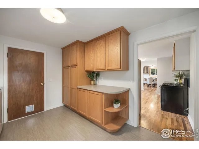 a view of living room with granite countertop furniture and wooden floor