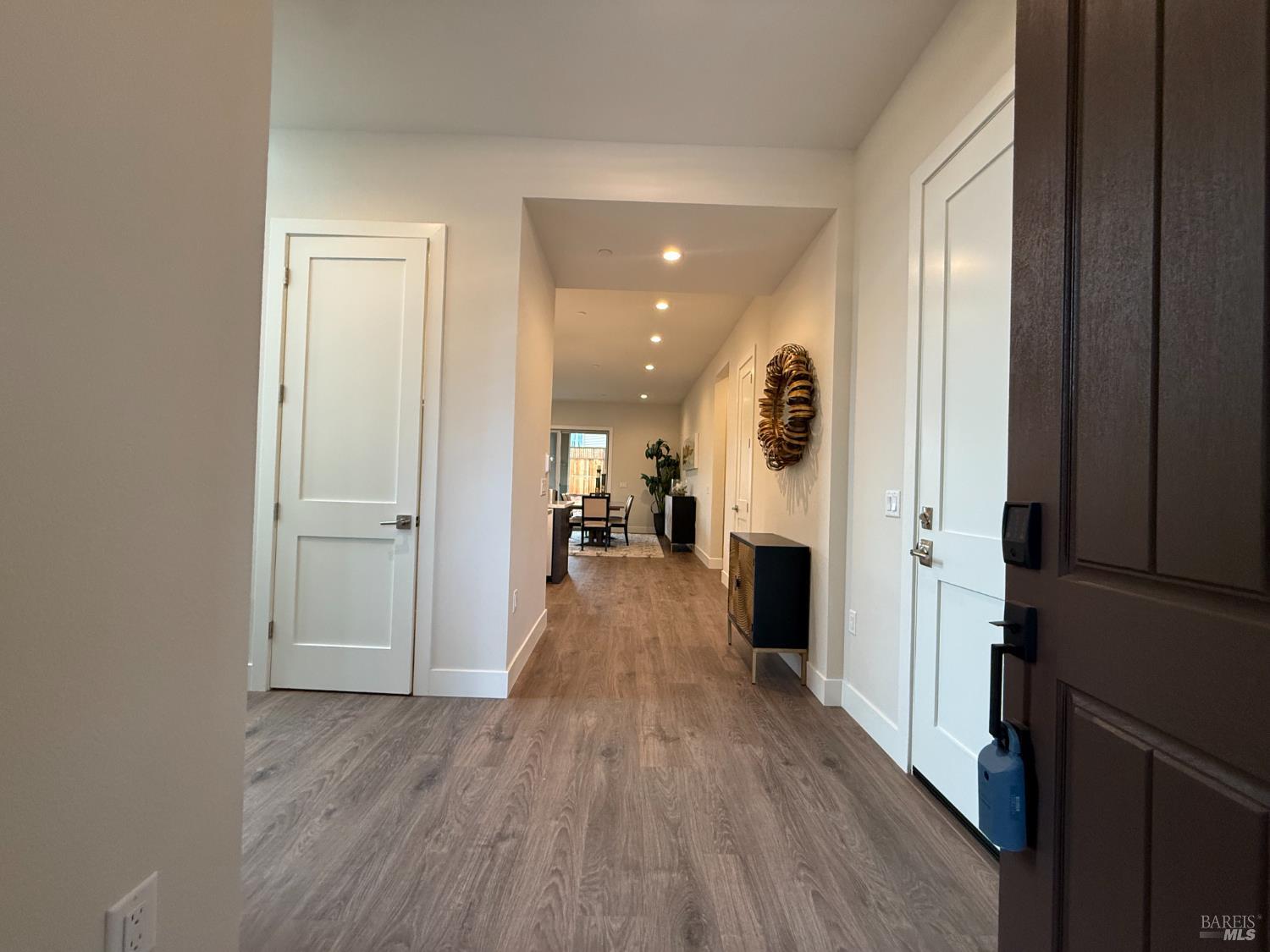 1901 Carlile Place Santa Rosa, CA 95403 - Photo 2 of 29 a view of a hallway with wooden floor and a fireplace