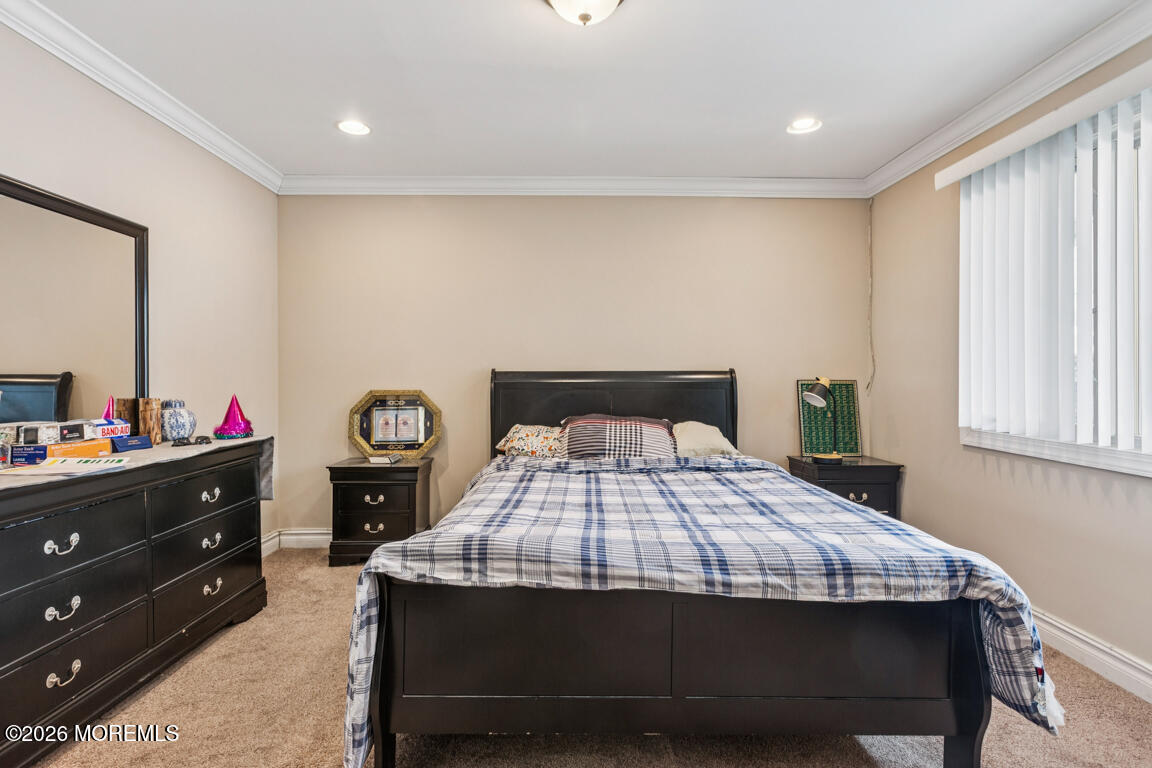 183 Pine Brook Road Manalapan, NJ 07726 - Photo 12 of 25 a bedroom with a bed and a dresser