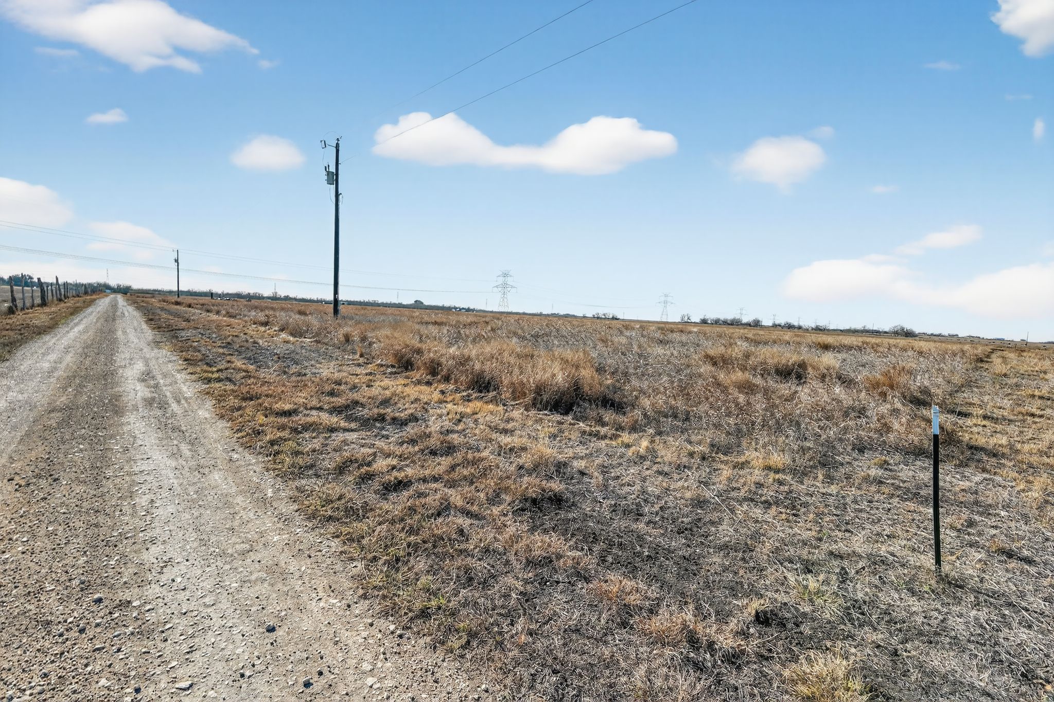 1557 Scull Road, Unit TRACT X San Marcos, TX 78666 - Photo 24 of 36 View of dirt / gravel road with a view of countryside