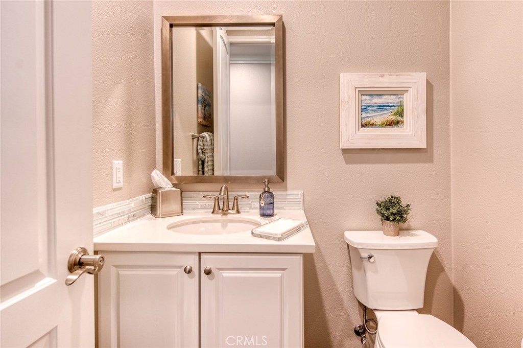 33 Lucido Street Rancho Mission Viejo, CA 92694 - Photo 13 of 37 a bathroom with a sink mirror and a toilet