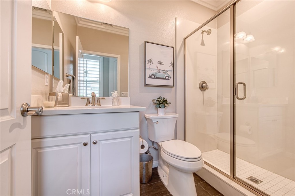 33 Lucido Street Rancho Mission Viejo, CA 92694 - Photo 15 of 37 a bathroom with a sink a toilet a mirror and shower
