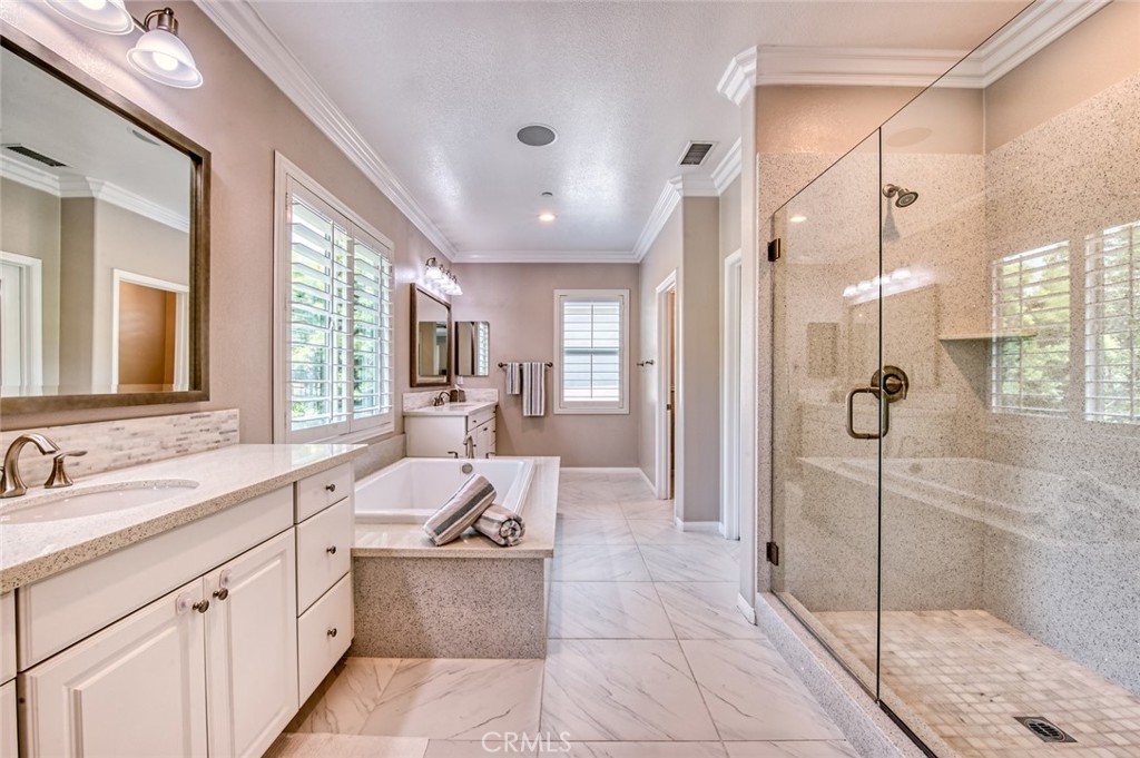 33 Lucido Street Rancho Mission Viejo, CA 92694 - Photo 19 of 37 a bathroom with a tub sink shower and mirror