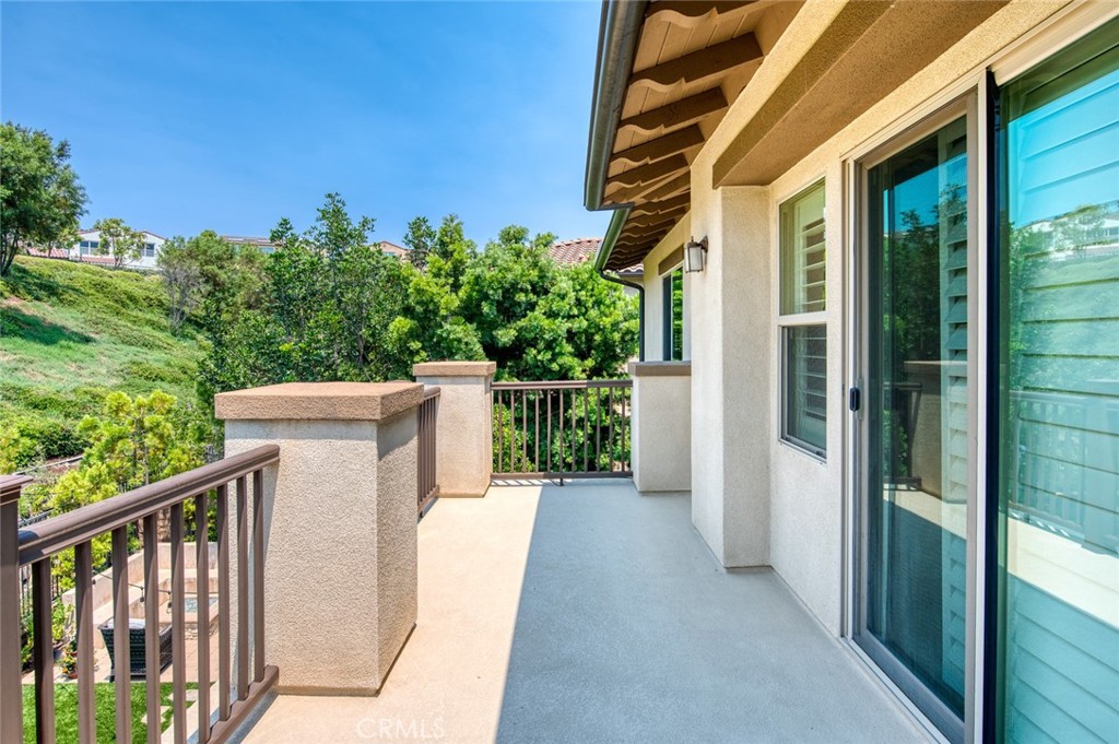 33 Lucido Street Rancho Mission Viejo, CA 92694 - Photo 22 of 37 a view of a balcony with wooden floor