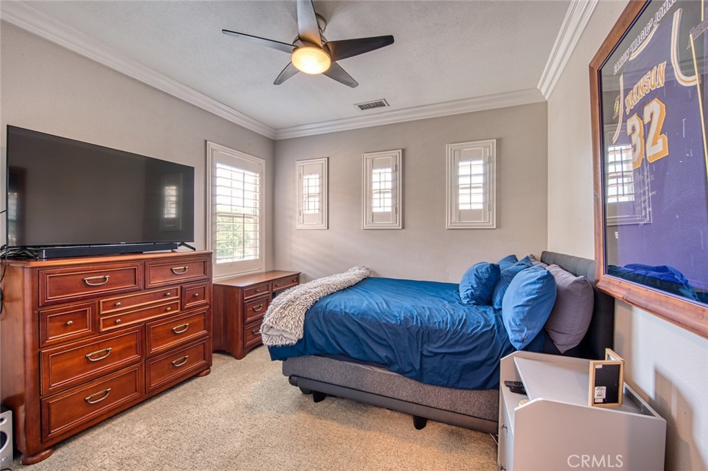 33 Lucido Street Rancho Mission Viejo, CA 92694 - Photo 25 of 37 a living room with a bed and furniture with a flat tv screen