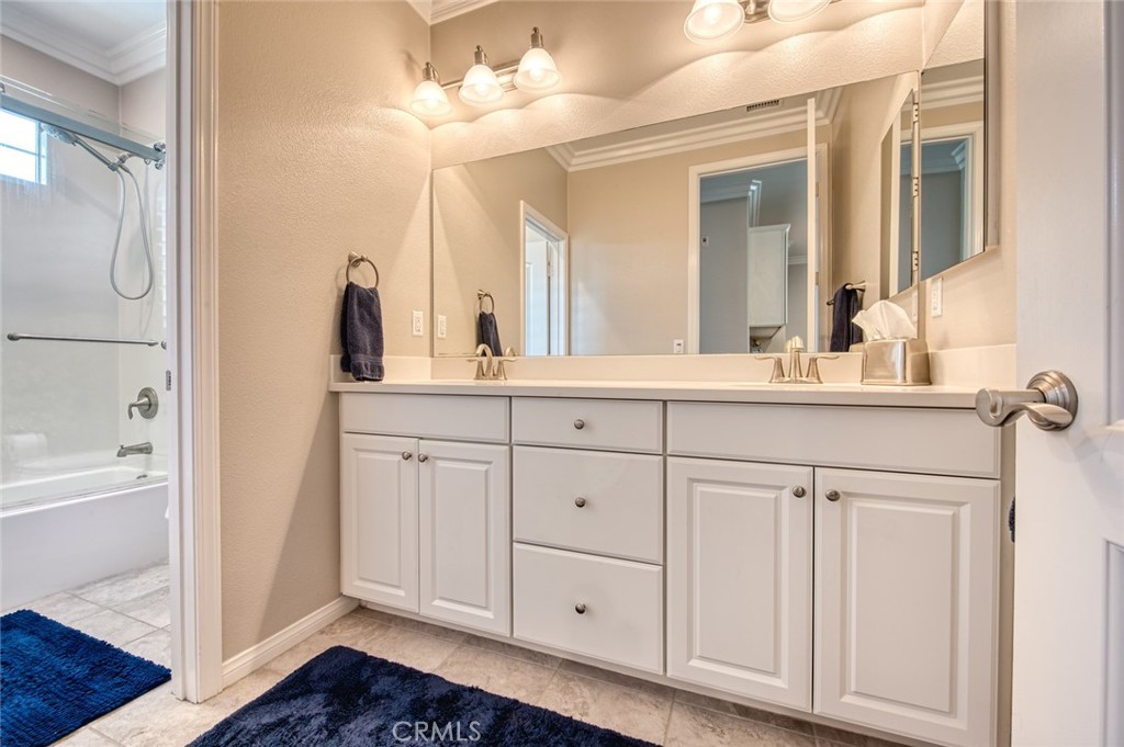 33 Lucido Street Rancho Mission Viejo, CA 92694 - Photo 26 of 37 a bathroom with a sink vanity and a mirror