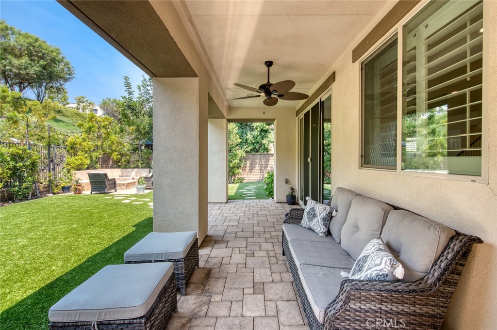 33 Lucido Street Rancho Mission Viejo, CA 92694 - Photo 28 of 37 a view of a patio with couches table and chairs and potted plants