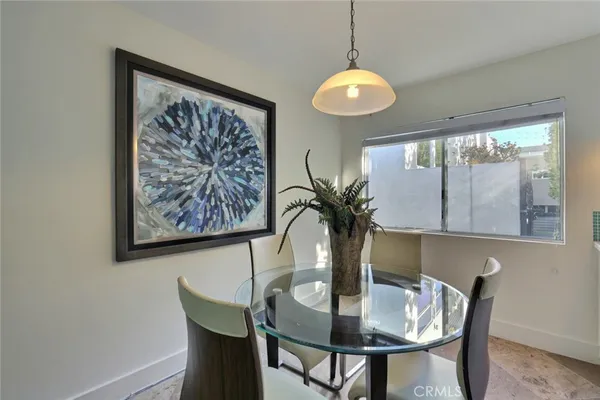 a view of a dining room with furniture and window