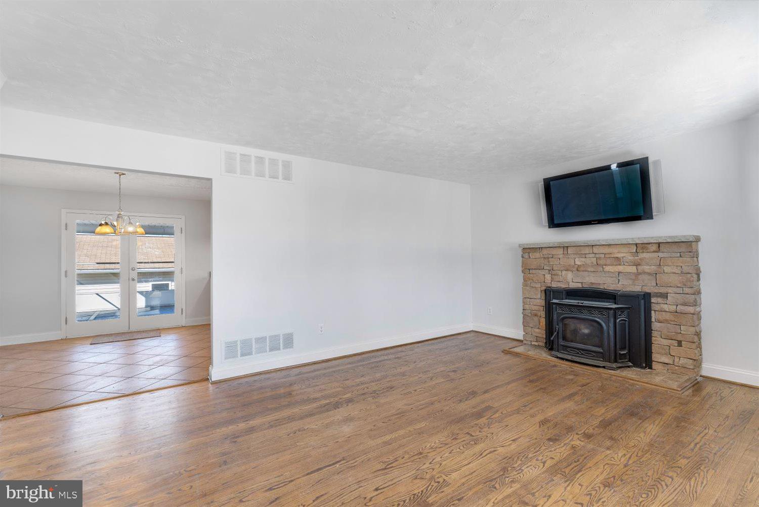 9728 Cross Road Perry Hall, MD 21128 - Photo 5 of 37 Spacious Living Room with Pellet Stove
