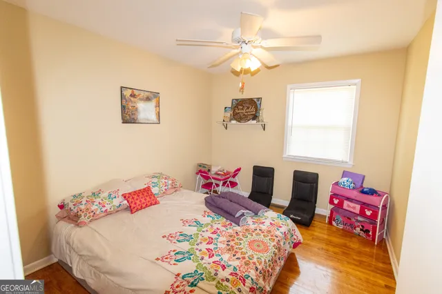 a bedroom with a bed and a table