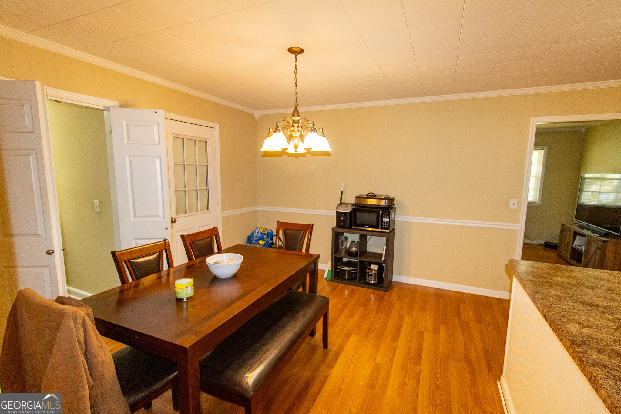 209 Elm Drive Brooklet, GA 30415 - Photo 10 of 30 a view of a dining room with furniture and wooden floor