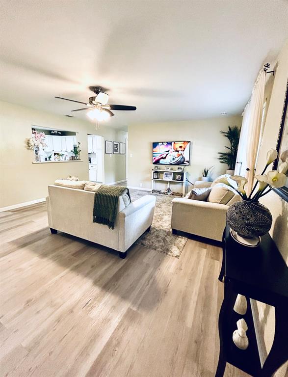 307 East 5th Street Kaufman, TX 75142 - Photo 1 of 27 a living room with furniture and a flat screen tv