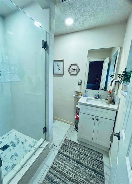 307 East 5th Street Kaufman, TX 75142 - Photo 14 of 27 a bathroom with a sink and a mirror