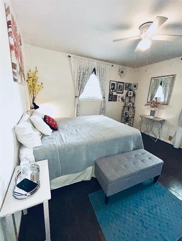 307 East 5th Street Kaufman, TX 75142 - Photo 23 of 27 a bedroom with a bed and a dresser in it