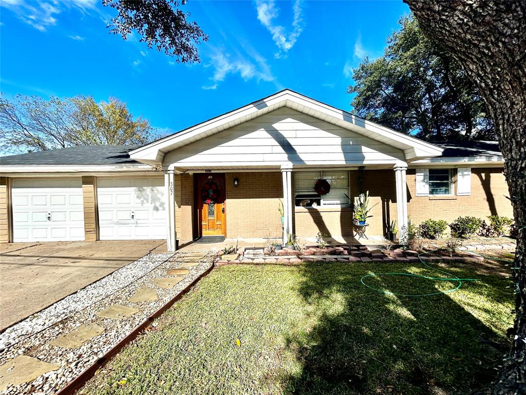 307 East 5th Street Kaufman, TX 75142 - Photo 26 of 27 a house view with a garden space
