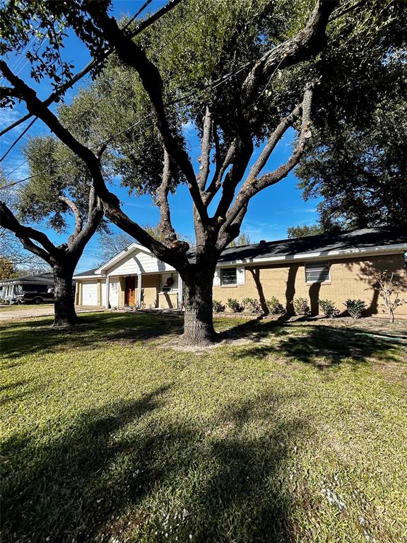307 East 5th Street Kaufman, TX 75142 - Photo 27 of 27 a house view with a garden space