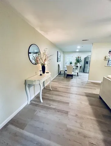 a living room with furniture and a clock