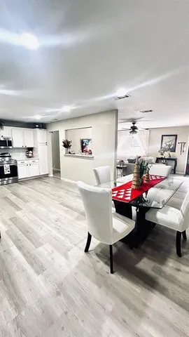 a bedroom with furniture and a chair