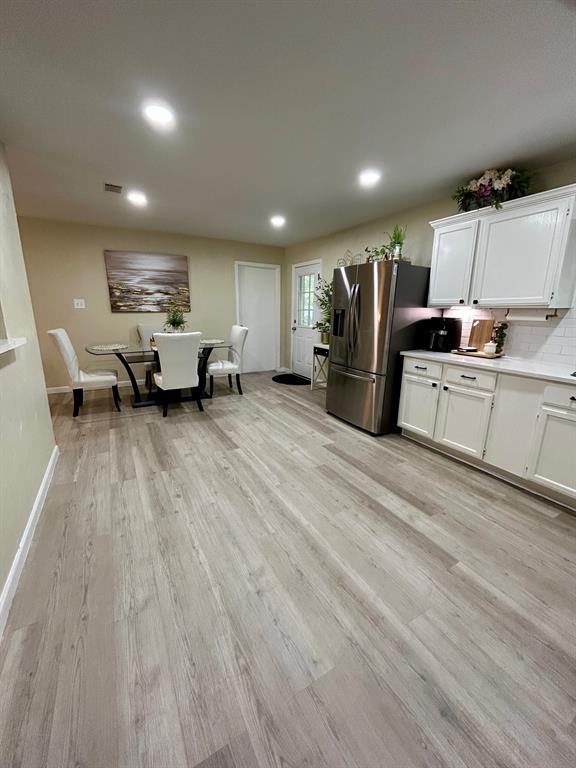 307 East 5th Street Kaufman, TX 75142 - Photo 10 of 27 a large room with lots of chairs and wooden floor