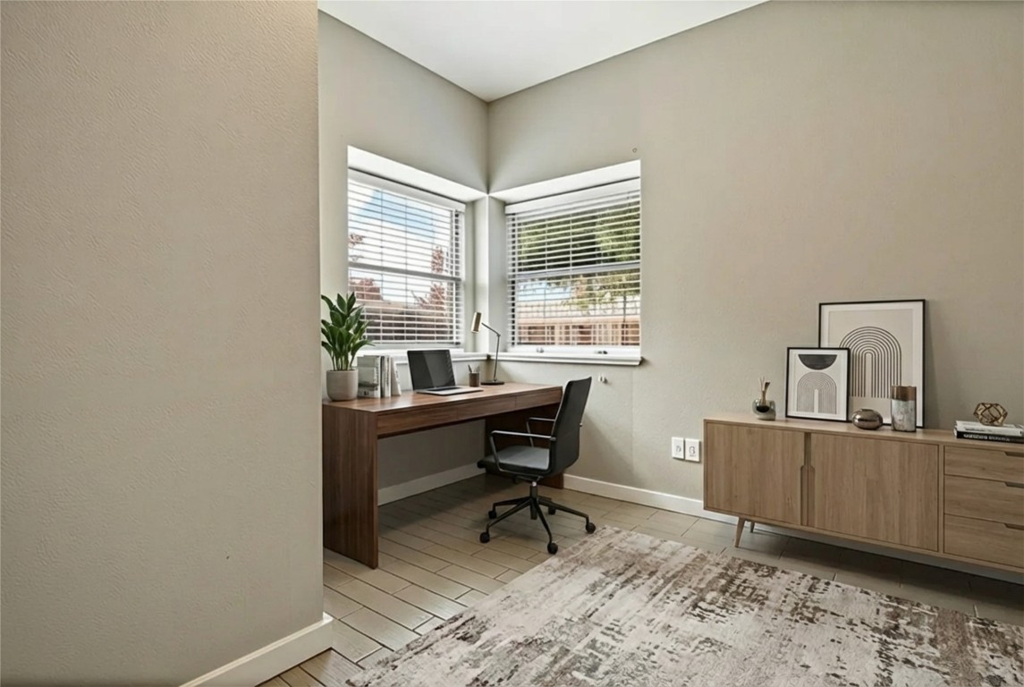 16801 Gravesend Road Pflugerville, TX 78660 - Photo 14 of 30 Virtually staged- Bedroom #2 featuring a textured wall and wood finished floors