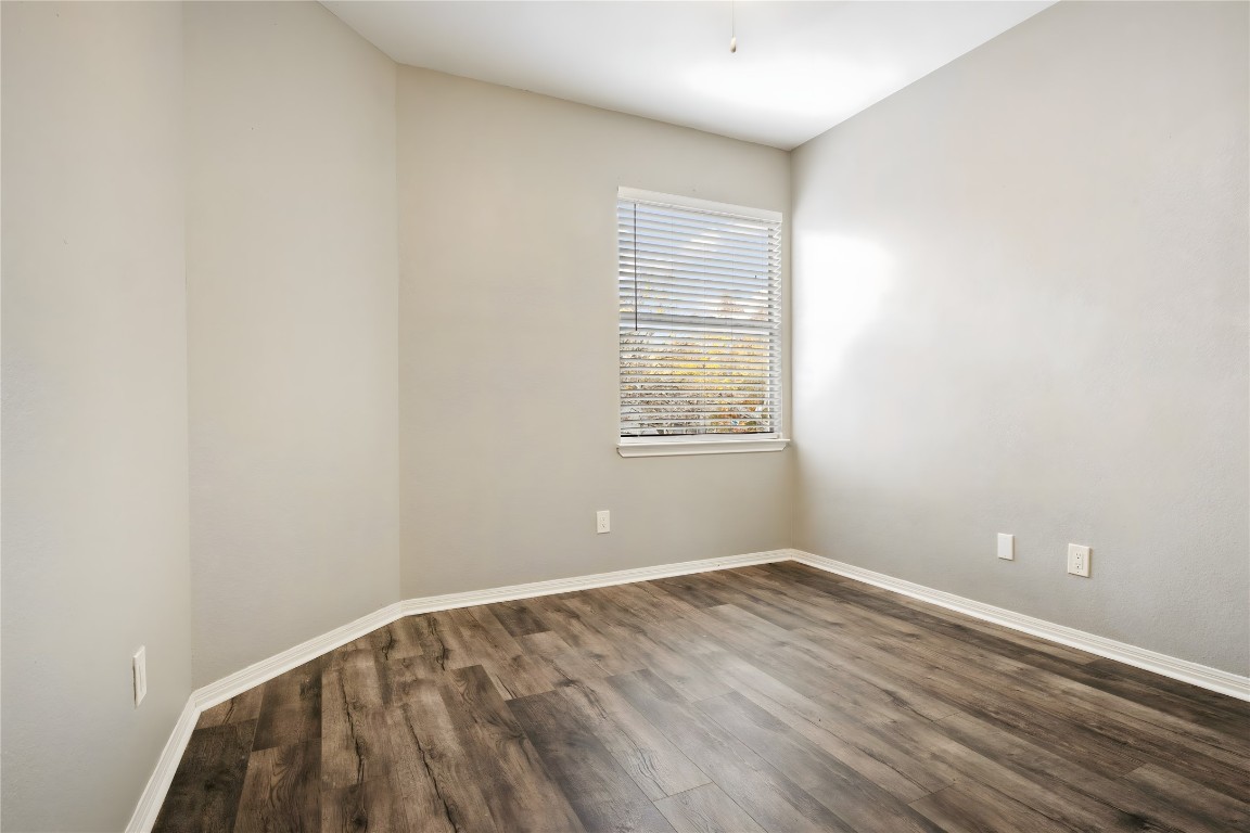 16801 Gravesend Road Pflugerville, TX 78660 - Photo 19 of 30 Bedroom #4 featuring a textured wall, wood finished floors and a ceiling fan