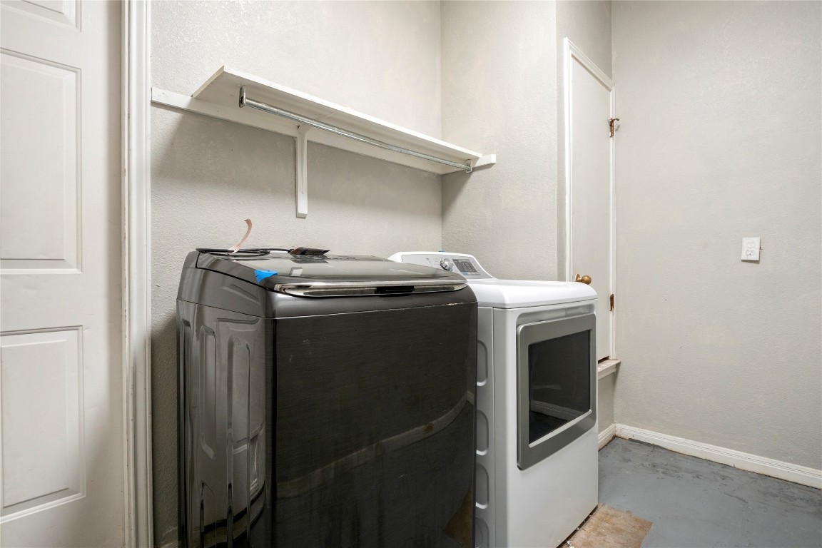 16801 Gravesend Road Pflugerville, TX 78660 - Photo 21 of 30 Laundry area featuring separate washer and dryer and concrete flooring