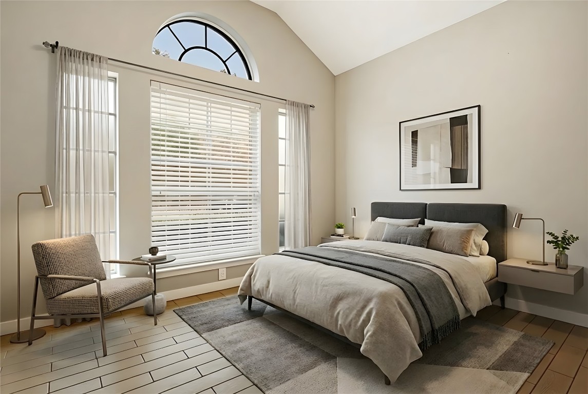 16801 Gravesend Road Pflugerville, TX 78660 - Photo 10 of 30 Virtually staged- Primary bedroom featuring lofted ceiling and wood finish floors