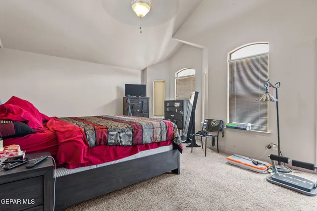 a bedroom with a bed and window