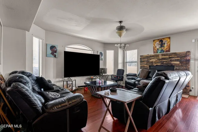a living room with furniture and a flat screen tv